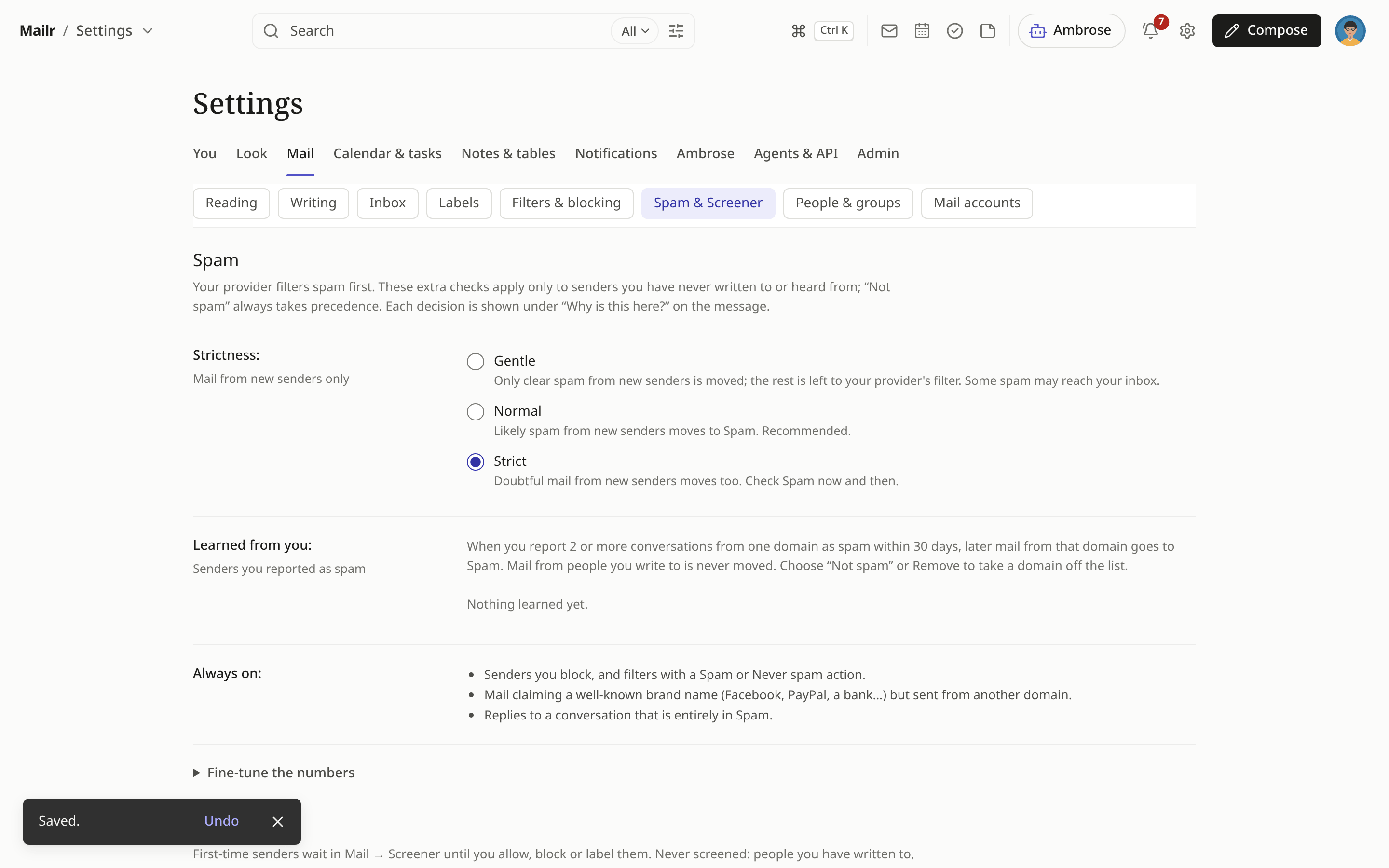 Settings → Mail → Spam & Screener in the Focus style, with the Saved notice